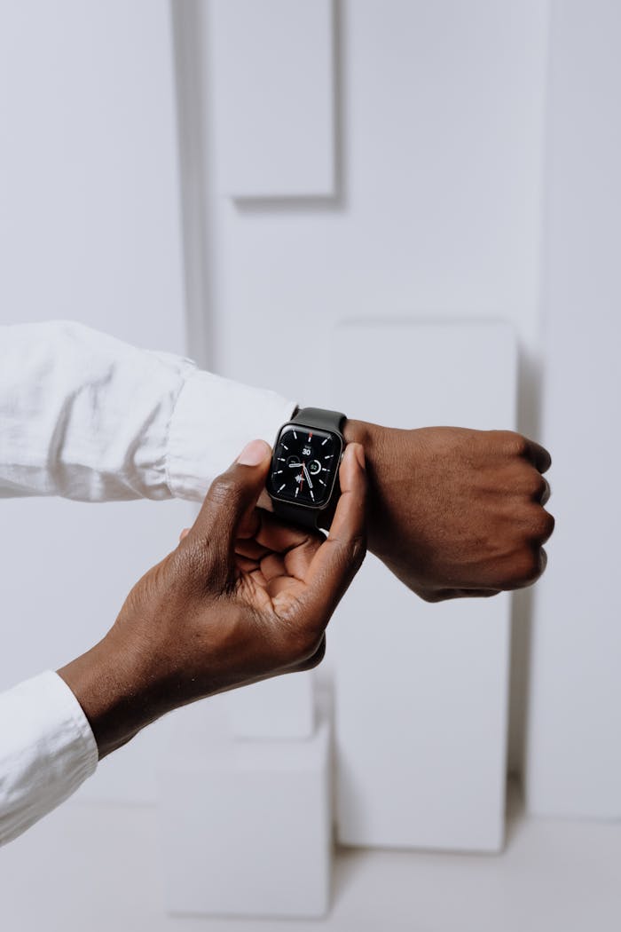 Close-up of a smartwatch on a person's wrist, highlighting modern technology with a minimalist aesthetic.
